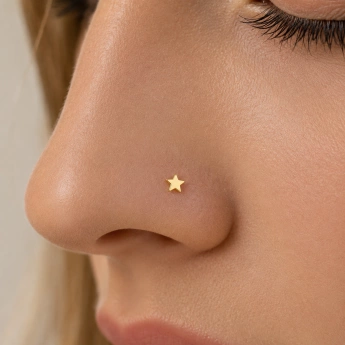 Ocelový zlacený piercing hvězda