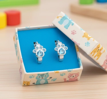 Stříbrné dětské náušnice tlapky s modrými zirkony