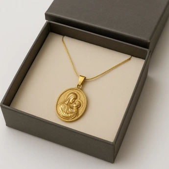 Ocelová madonka s dítětem ve zlatém tónu